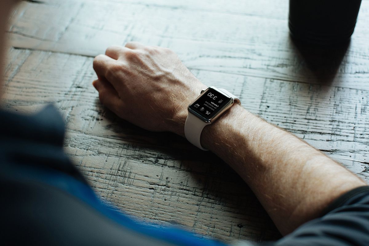 man wearing white smartwatch